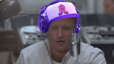 A Man Wearing Headphones And A Hat That Says R On It GIF