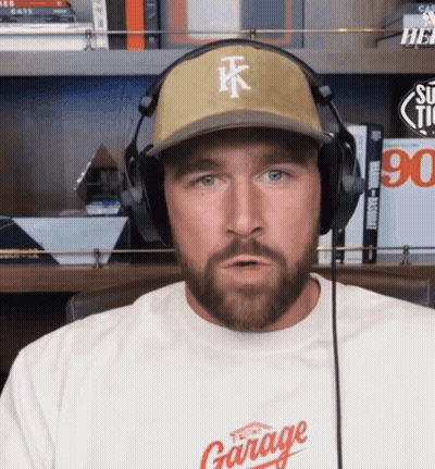 A Man Wearing Headphones And A Hat That Says Tk GIF