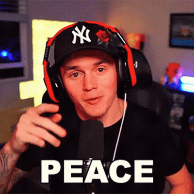 A Man Wearing Headphones And A Hat With Ny On It GIF