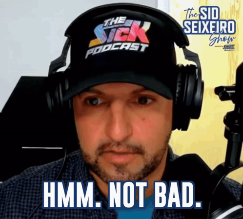 A Man Wearing Headphones And A Hat With The Word Podcast On It GIF