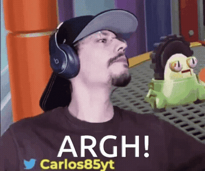 A Man Wearing Headphones And A Hat With The Words Argh Carlos85yt On His Shirt GIF