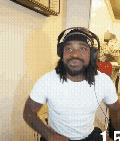 A Man Wearing Headphones And A Headband With The Number 15 On The Bottom GIF