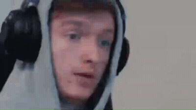 A Man Wearing Headphones And A Hoodie Is Saying Sorry . GIF
