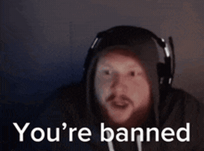 A Man Wearing Headphones And A Hoodie Is Saying You 'Re Banned . GIF