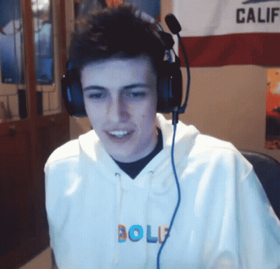 A Man Wearing Headphones And A Hoodie That Says Golf GIF