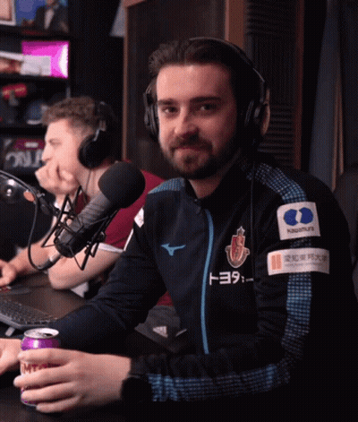 A Man Wearing Headphones And A Jacket That Has Toyota On It GIF