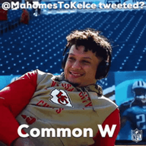 A Man Wearing Headphones And A Kansas City Chiefs Jersey Is Smiling GIF