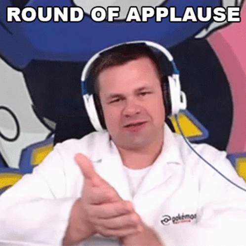 A Man Wearing Headphones And A Lab Coat Is Giving A Thumbs Up . GIF