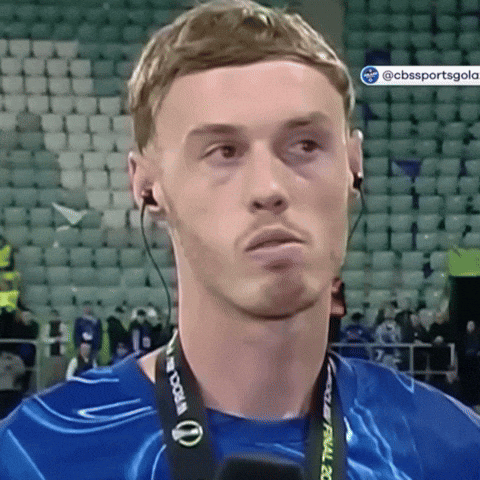 A Man Wearing Headphones And A Lanyard That Says World Cup GIF