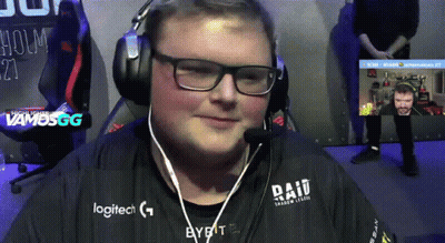 A Man Wearing Headphones And A Logitech Shirt Is Smiling GIF