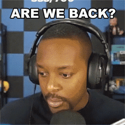 A Man Wearing Headphones And A Microphone Is Asking Are We Back GIF