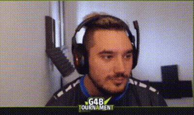 A Man Wearing Headphones And A Microphone Is Looking At The Camera . GIF