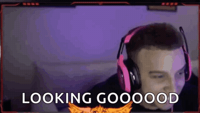 A Man Wearing Headphones And A Microphone Is Looking At The Camera And Saying `` Looking Good '' . GIF