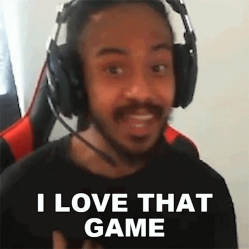 A Man Wearing Headphones And A Microphone Is Making A Funny Face And Saying `` I Love That Game '' . GIF