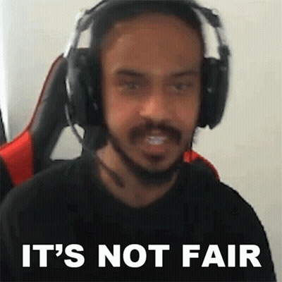 A Man Wearing Headphones And A Microphone Is Making A Funny Face And Saying It 'S Not Fair . GIF