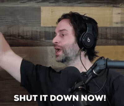A Man Wearing Headphones And A Microphone Is Saying Shut It Down Now GIF