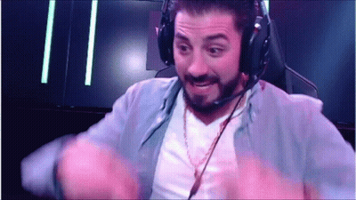 A Man Wearing Headphones And A Microphone Is Sitting In A Chair . GIF