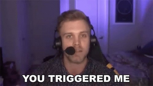 A Man Wearing Headphones And A Microphone Is Sitting In Front Of A Computer Screen . GIF