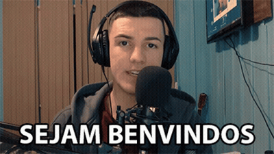 A Man Wearing Headphones And A Microphone With The Words Sejam Benvindos Below Him GIF