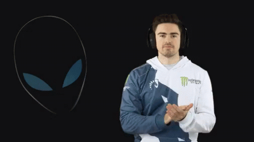 A Man Wearing Headphones And A Monster Energy Hoodie Applauds GIF