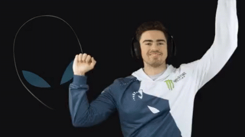 A Man Wearing Headphones And A Monster Energy Shirt Is Dancing GIF