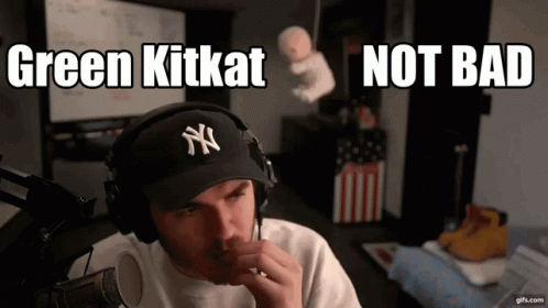 Man Wearing Headphones And Yankees Hat Says Green KitKat Not Bad GIF