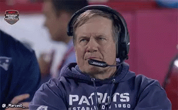 A Man Wearing Headphones And A Patriots Sweatshirt . GIF