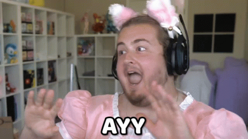 A Man Wearing Headphones And A Pink Dress With Ayy Written On It GIF