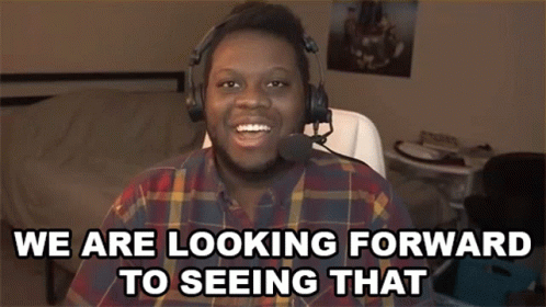 A Man Wearing Headphones And A Plaid Shirt Says We Are Looking Forward To Seeing That . GIF
