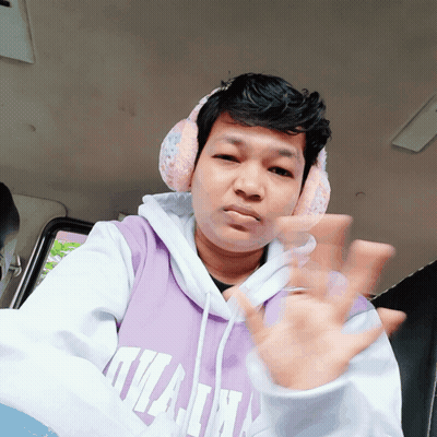 A Man Wearing Headphones And A Purple Hoodie That Says Kilian On It GIF