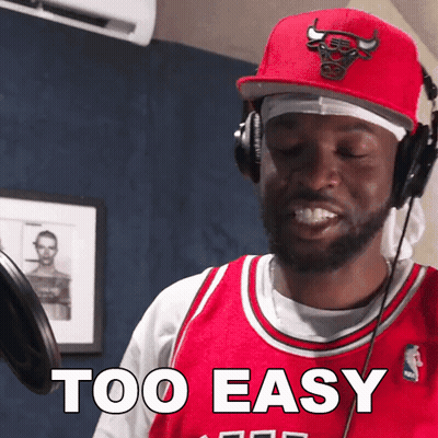 A Man Wearing Headphones And A Red Bulls Hat Says " Too Easy " GIF