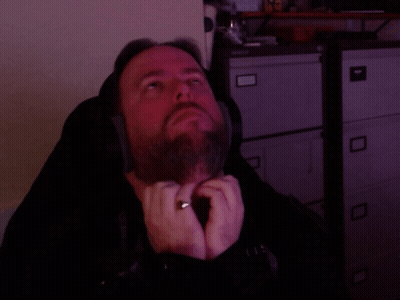 A Man Wearing Headphones And A Ring On His Finger GIF