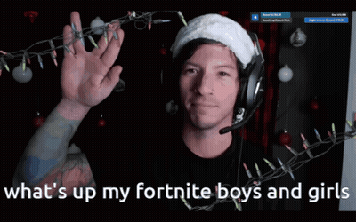 A Man Wearing Headphones And A Santa Hat With The Words What 'S Up My Fortnite Boys And Girls Below Him GIF