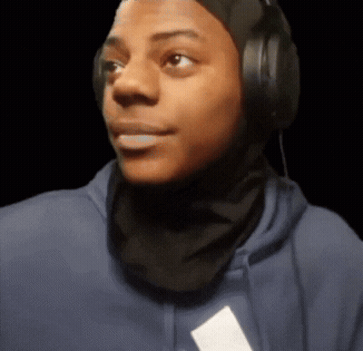 A Man Wearing Headphones And A Scarf Around His Head GIF