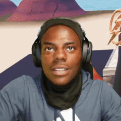 A Man Wearing Headphones And A Scarf Is Looking At The Camera GIF