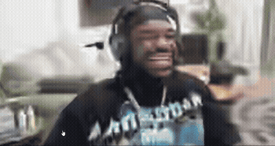 A Man Wearing Headphones And A Shirt That Says Amsterdam Is Smiling GIF