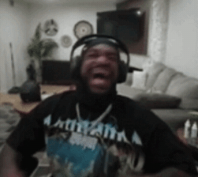 A Man Wearing Headphones And A Shirt That Says Atlanta GIF