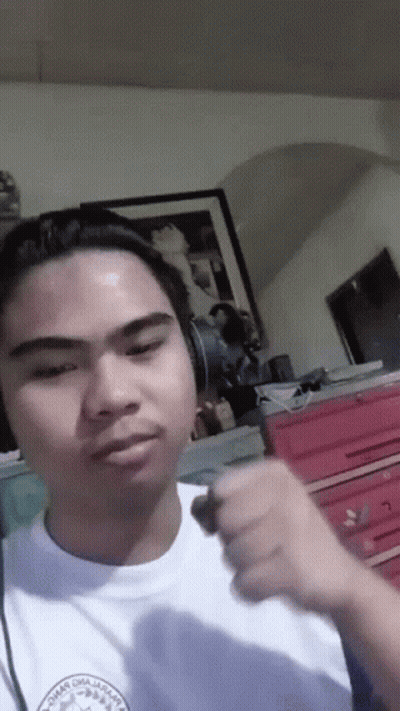 A Man Wearing Headphones And A Shirt That Says " Chicago Omaha " GIF