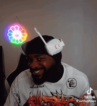 A Man Wearing Headphones And A Shirt That Says Hellstar On It GIF