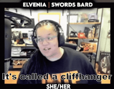 A Man Wearing Headphones And A Shirt That Says " It 'S Called A Cliffhanger She / Her " GIF