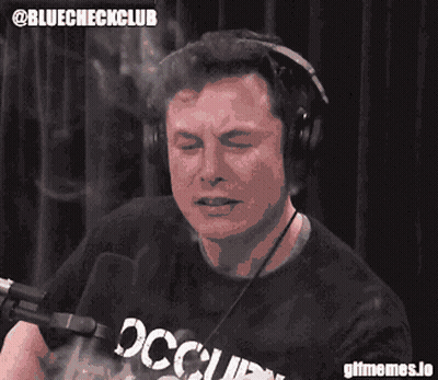 A Man Wearing Headphones And A Shirt That Says Occupied On It GIF
