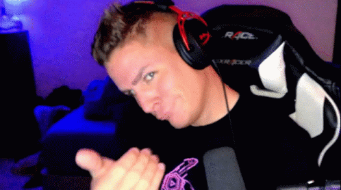 A Man Wearing Headphones And A Shirt That Says Race On It GIF