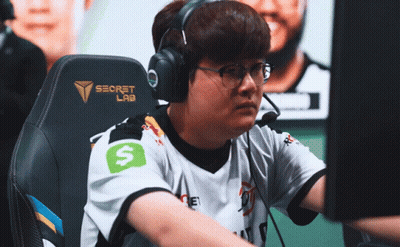 A Man Wearing Headphones And A Shirt That Says Secret Lab GIF