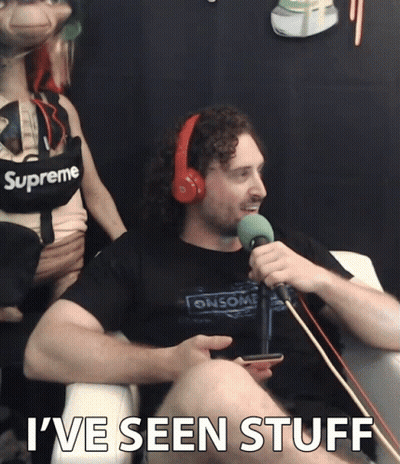A Man Wearing Headphones And A Shirt That Says Supreme GIF