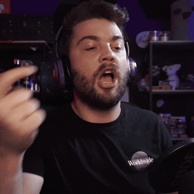 A Man Wearing Headphones And A Shirt That Says Worldwide On It GIF