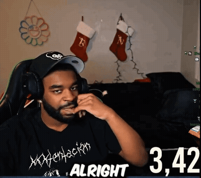 A Man Wearing Headphones And A Shirt That Says Xxxtentacion GIF