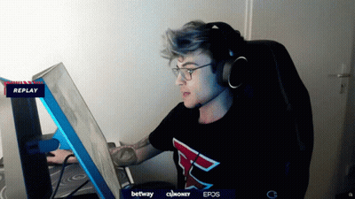 A Man Wearing Headphones And A Shirt With The Letter F On It Looks At A Computer Screen GIF