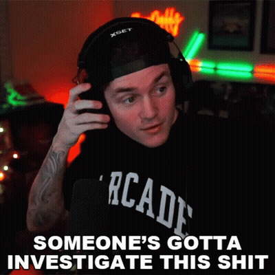 A Man Wearing Headphones And A T-Shirt That Says Arcade GIF