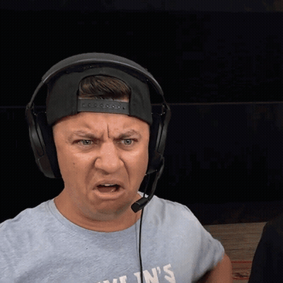 A Man Wearing Headphones And A T-Shirt That Says Kylin 'S Making A Funny Face GIF