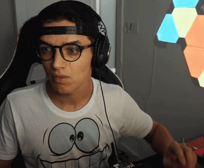A Man Wearing Headphones And A T-Shirt With A Smiley Face On It GIF